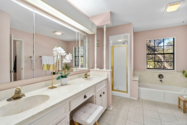 full bath featuring a bath, a sink, visible vents, and tile patterned floors