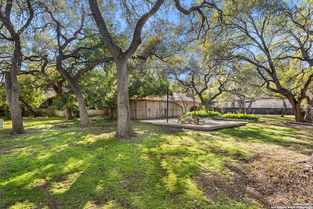 view of yard featuring a patio and fence