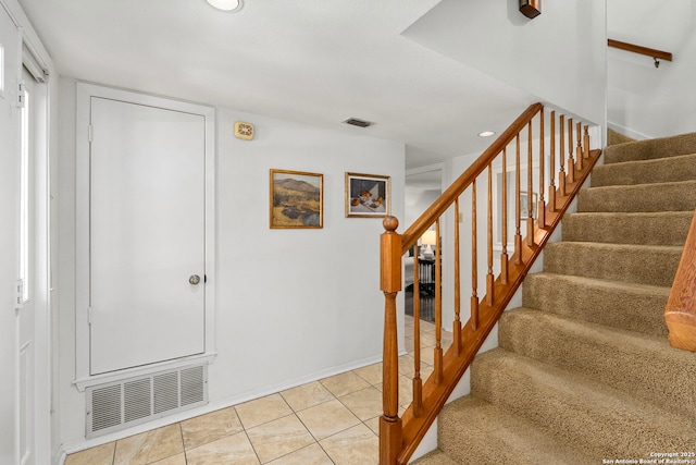 stairs with tile patterned flooring, visible vents, and recessed lighting