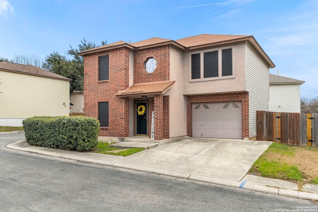 view of front of house featuring driveway, brick siding, an attached garage, and fence