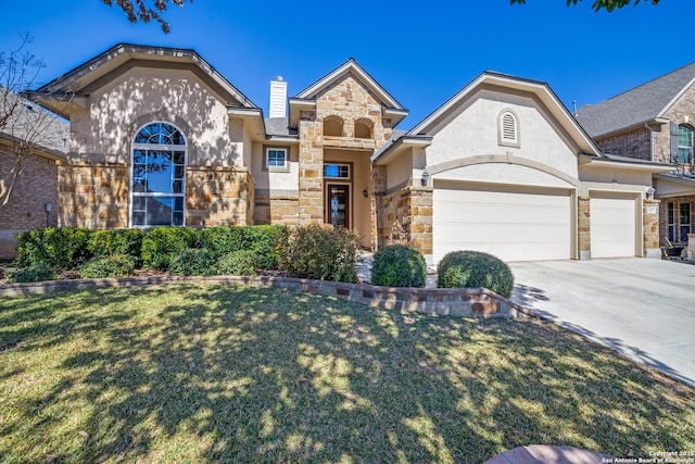 view of front of property with a garage, stone siding, a front lawn, and driveway