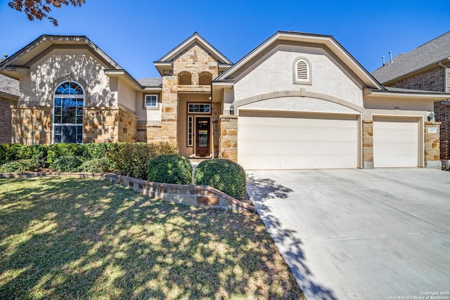 view of front facade featuring concrete driveway, stone siding, an attached garage, a front yard, and stucco siding