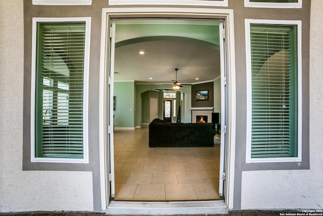 entrance to property featuring stucco siding