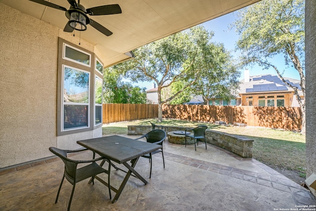 view of patio / terrace with ceiling fan, outdoor dining area, and a fenced backyard