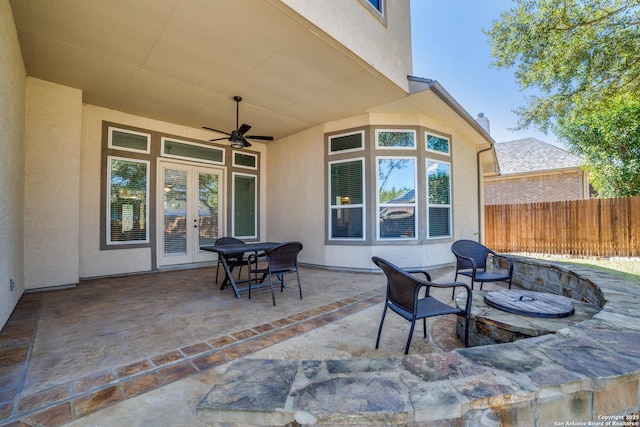 view of patio / terrace featuring ceiling fan and fence