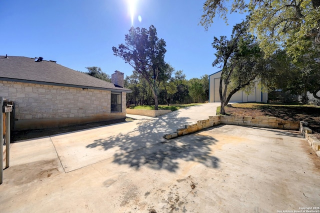 view of yard with an outbuilding and a detached garage