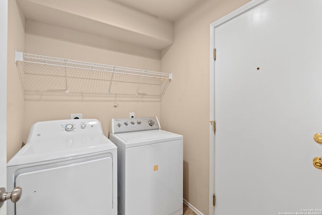 laundry area with laundry area and independent washer and dryer