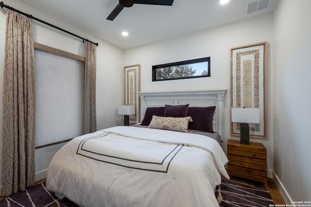 bedroom with baseboards, visible vents, dark wood finished floors, ceiling fan, and recessed lighting