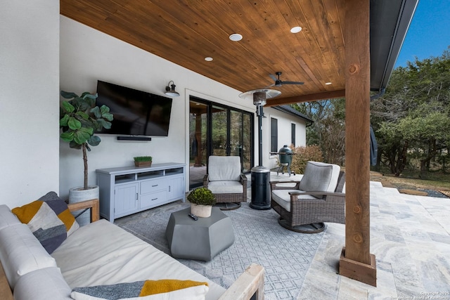 view of patio / terrace featuring ceiling fan and an outdoor living space