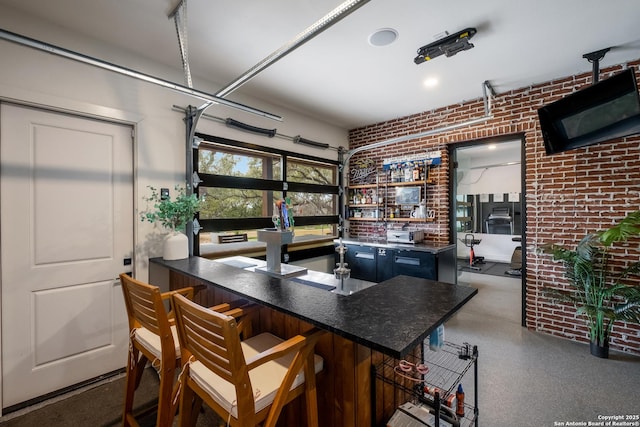 bar with brick wall and dark speckled floor