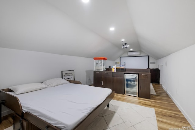 bedroom featuring recessed lighting, beverage cooler, baseboards, vaulted ceiling, and light wood-type flooring