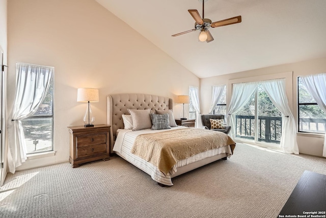 carpeted bedroom featuring access to outside, high vaulted ceiling, a ceiling fan, and baseboards