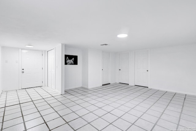 empty room with visible vents and baseboards