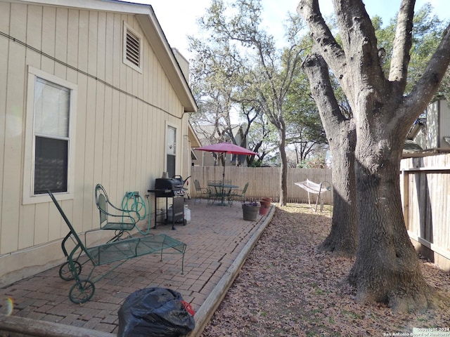 view of yard with a patio and fence