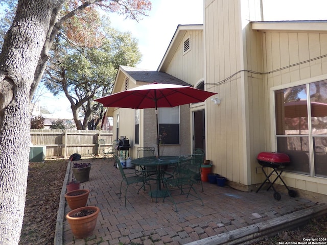 view of patio / terrace featuring outdoor dining space and fence