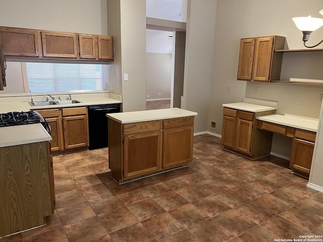 kitchen with black dishwasher, light countertops, brown cabinetry, and a sink