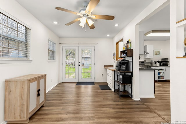 entryway featuring recessed lighting, french doors, dark wood finished floors, and baseboards