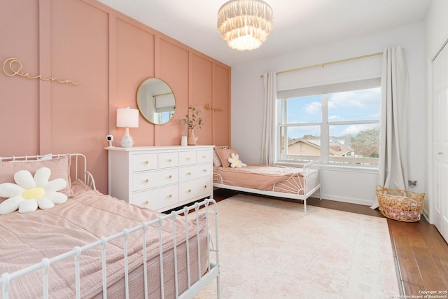 bedroom with wood finished floors