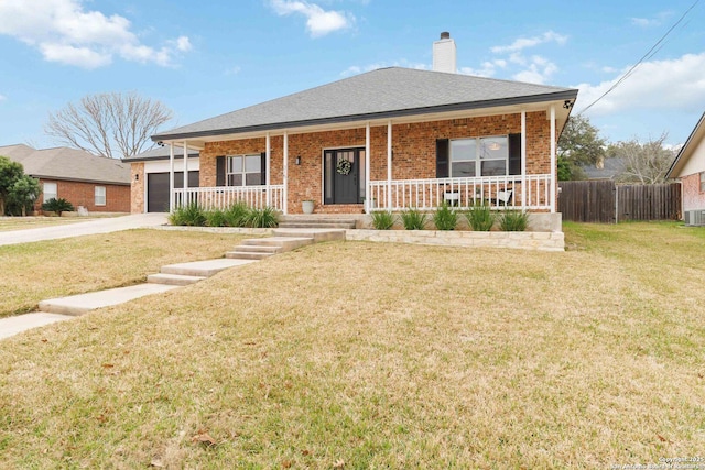 ranch-style house featuring driveway, a chimney, an attached garage, covered porch, and brick siding