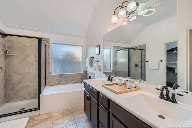 bathroom with vaulted ceiling, ornamental molding, a stall shower, and a sink