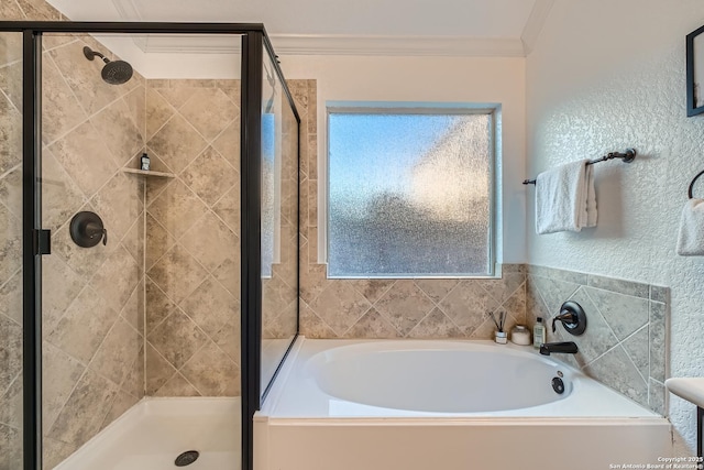 bathroom featuring ornamental molding, a stall shower, and a garden tub