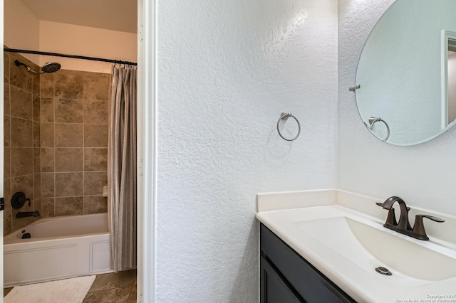 bathroom featuring shower / bath combo, tile patterned flooring, and vanity