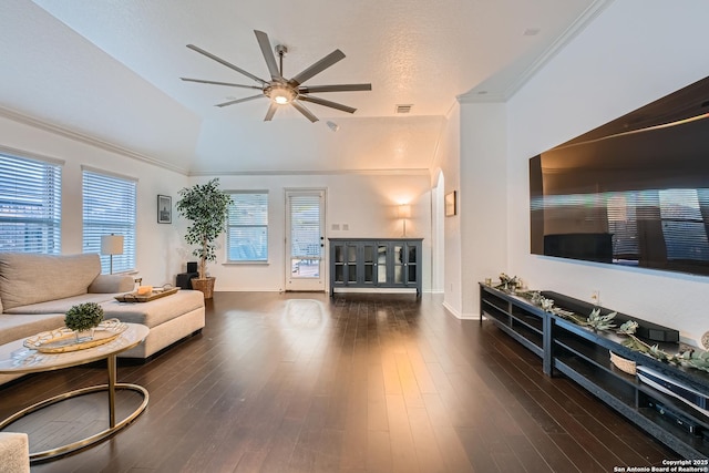 living area with ceiling fan, ornamental molding, dark wood finished floors, and visible vents