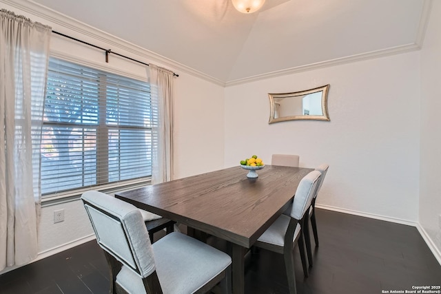 dining room with lofted ceiling, baseboards, and dark wood-style flooring