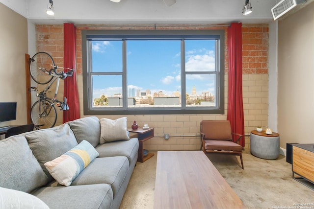 living area featuring a view of city and visible vents