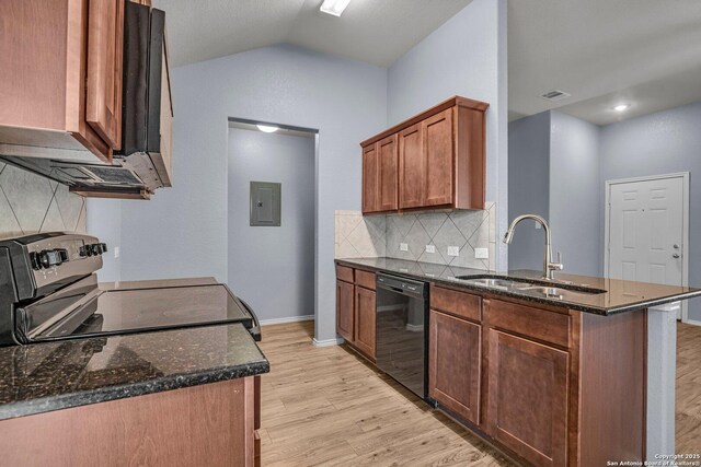 kitchen with dark stone counters, a sink, light wood-type flooring, dishwasher, and stainless steel electric range oven