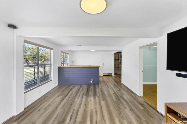 unfurnished living room with wood finished floors