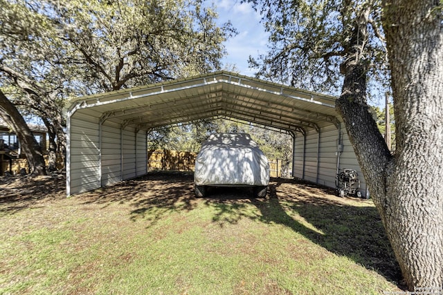 view of parking featuring a detached carport and driveway