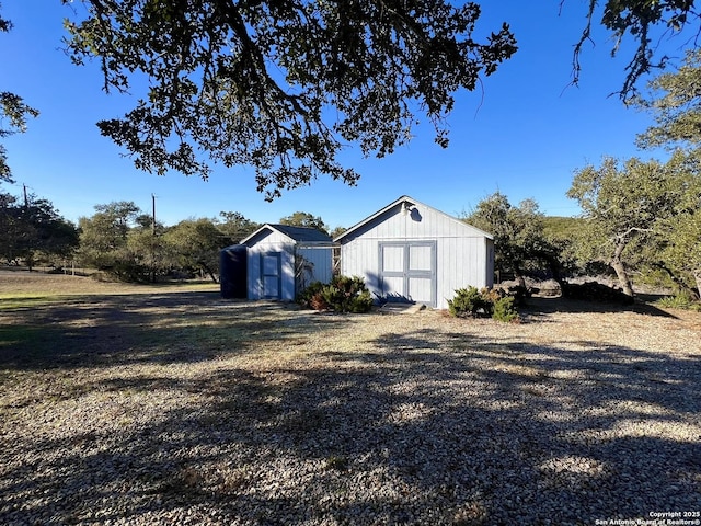 garage featuring a storage unit