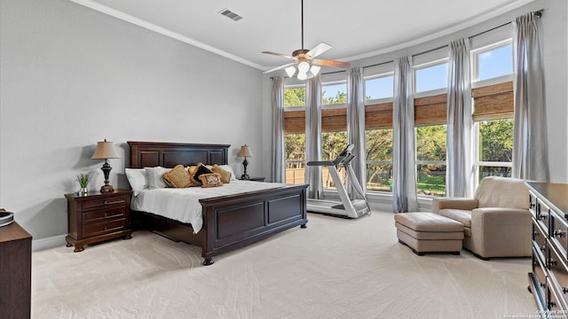 bedroom featuring light carpet, baseboards, visible vents, a ceiling fan, and crown molding