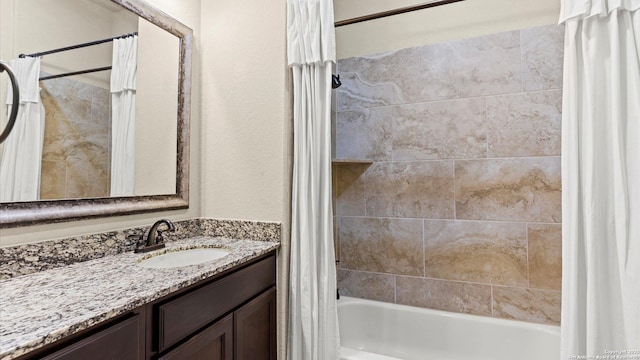 full bathroom with shower / bathtub combination with curtain and vanity