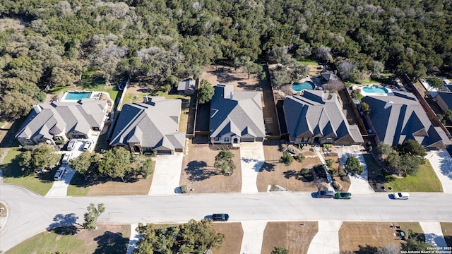 bird's eye view featuring a residential view and a view of trees