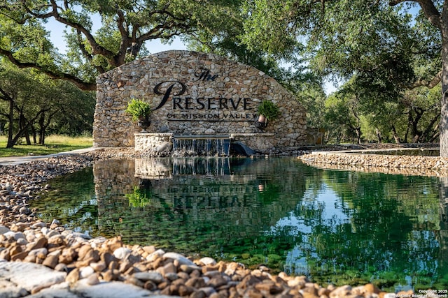 community sign with a water view