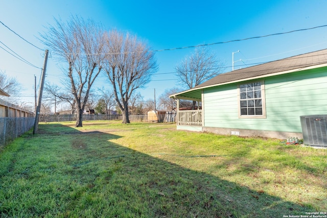 view of yard with fence and cooling unit