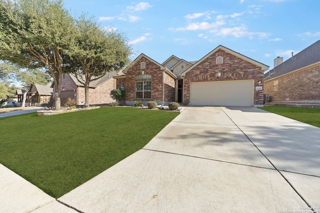 view of front of home featuring an attached garage, driveway, brick siding, and a front yard