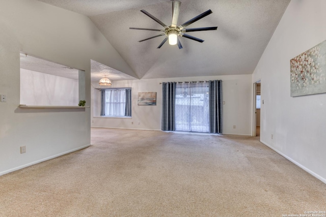 unfurnished living room with ceiling fan, carpet floors, a textured ceiling, and vaulted ceiling