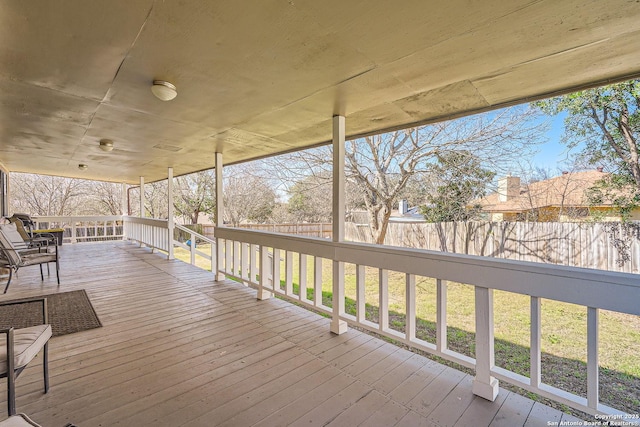 wooden deck featuring fence