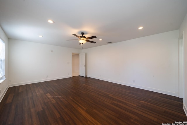 spare room with recessed lighting, dark wood-style flooring, ceiling fan, and baseboards