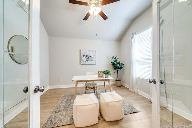 office with vaulted ceiling, french doors, light wood-type flooring, and baseboards