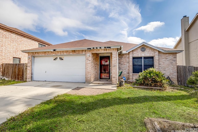 ranch-style home featuring driveway, an attached garage, fence, and a front yard