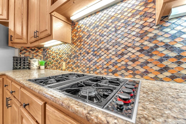 kitchen featuring black gas cooktop and tasteful backsplash