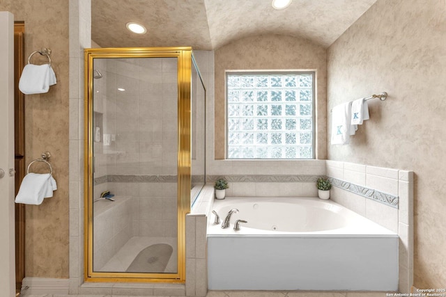 bathroom with a stall shower and a bath