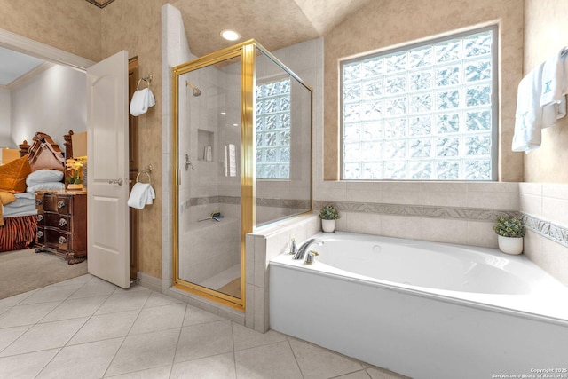 bathroom with a garden tub, a shower stall, crown molding, and tile patterned floors