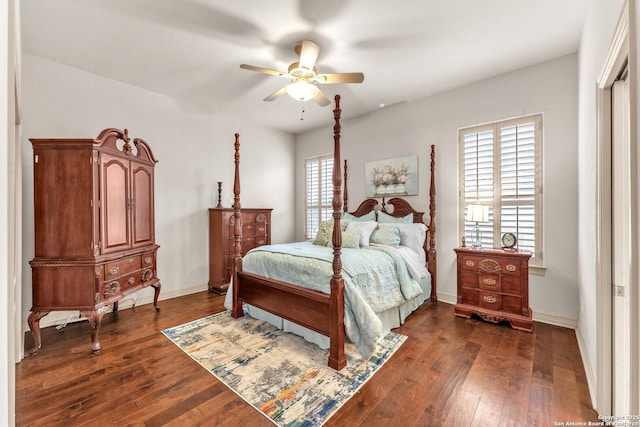 bedroom featuring dark wood finished floors, baseboards, and ceiling fan