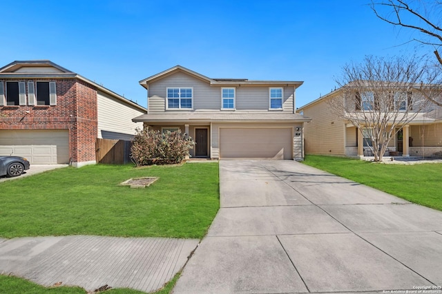 traditional home with a garage, concrete driveway, a front yard, and fence