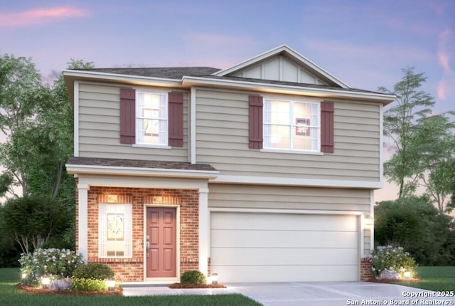 view of front of property featuring a garage, brick siding, driveway, and board and batten siding